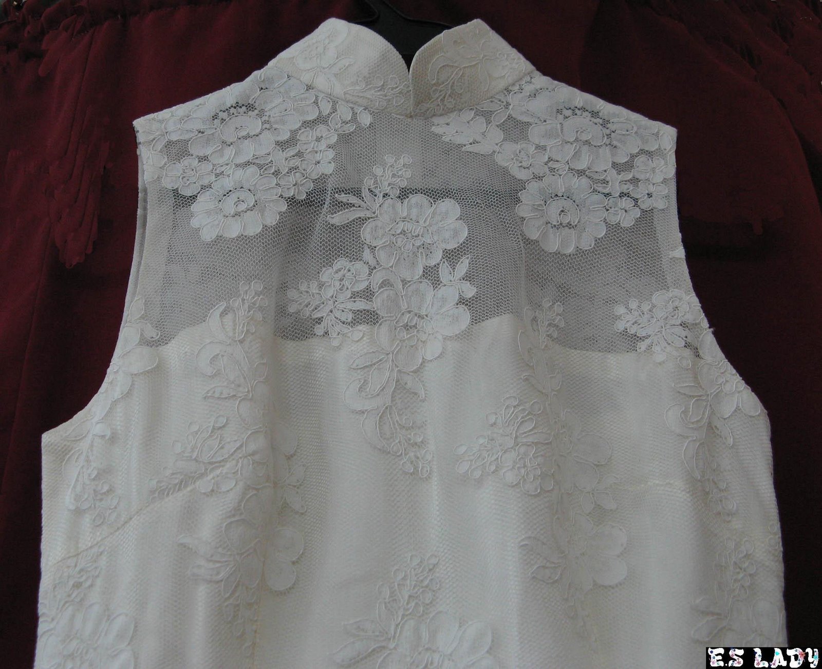 Close-up of corded lace on a mandarin collar top, hand finished