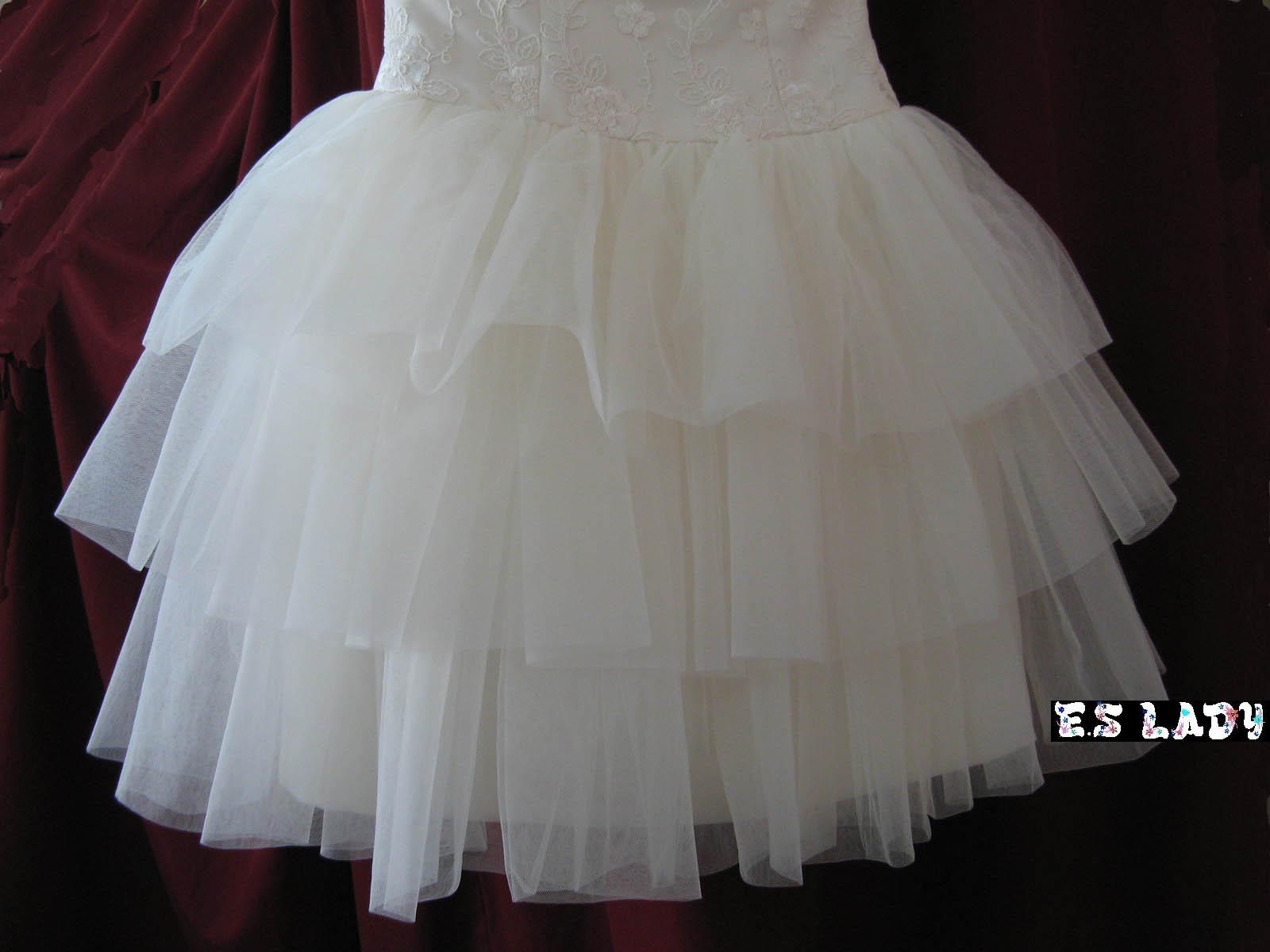 Tiered tulle skirt detail of a custom wedding gown
